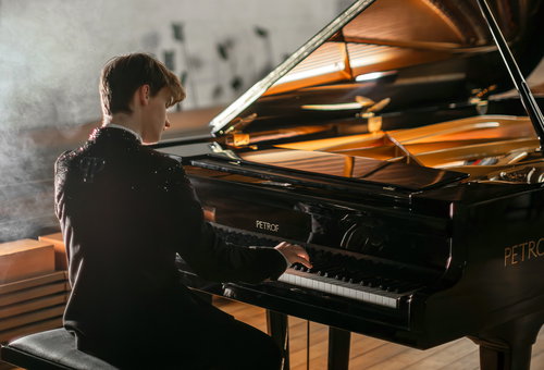 Photo illustrating a concert - event PIANO RECITAL with a string quartet Music by Ludovico Einaudi